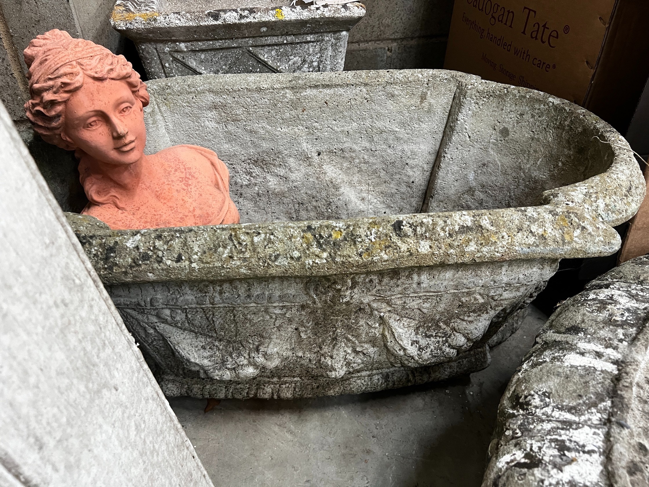 A reconstituted stone oval garden planter, width 80cm height 30cm, together with a square planter, another smaller and a pottery garden bust